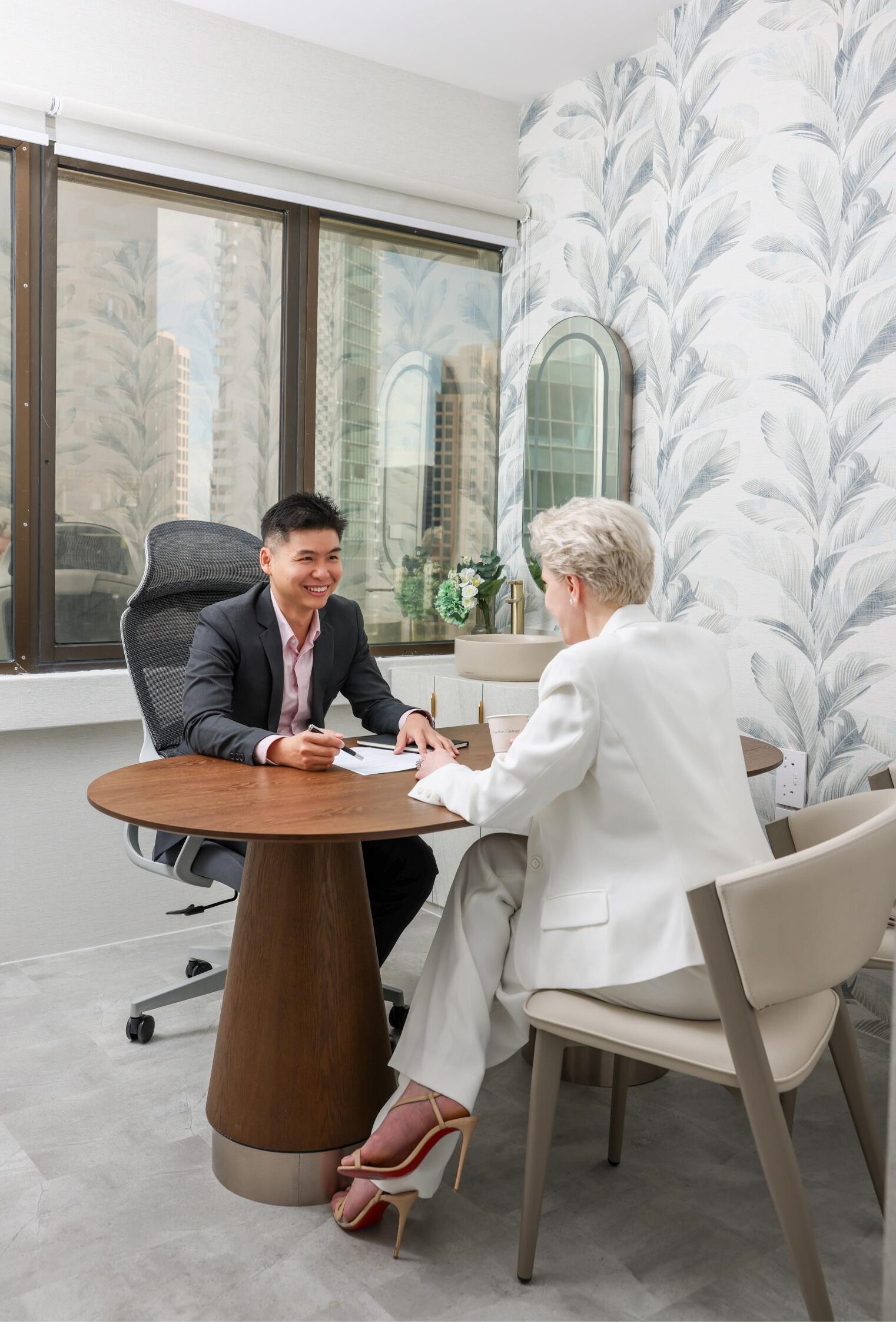 Doctor Tay Kai Hong Speaking with a Patient