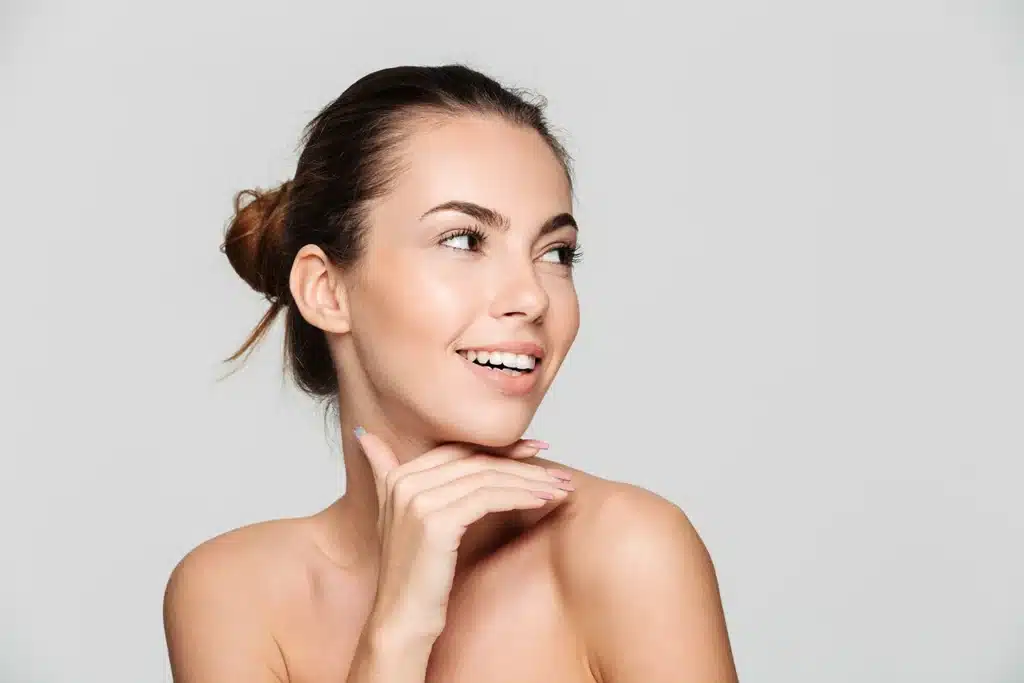 Portrait of a young, beautiful woman holding her chin
